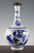 A Chinese blue and white bottle vase, early Kangxi period, c.1670, the body painted to a fan