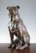 A late 19th century Austrian painted earthenware model of a seated dog, with glass inset eyes 21in.