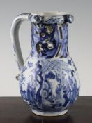 A rare Chinese blue and white puzzle jug, Kangxi period, painted with ladies and children in