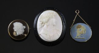 A Mintons pate-sur-pate button, a Wedgwood jasper plaque and a shell cameo brooch, 19th/early 20th