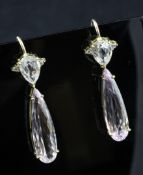 A pair of gold, kunzite and diamond set drop earrings, with elongated pear shaped stones, 1.5in.