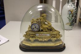 A 19th century French gilt metal and Sevres style porcelain mantel clock, surmounted with a figure