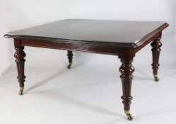A Victorian style mahogany extending dining table, with four extra leaves, on turned and fluted