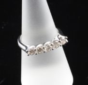 An 18ct white gold and five stone diamond half hoop ring, with a total diamond weight of 1.02ct,