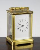 A French lacquered brass hour repeating carriage clock, with movement striking on gong number