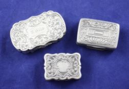 Three 19th century silver vinaigrettes, oval by Alfred Taylor, Birmingham, 1856, rectangular by
