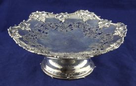 A Georg V pierced silver pedestal fruit dish, with fruiting vine border and pierced decoration,