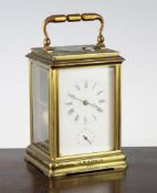 A 19th century French brass hour repeating carriage alarum clock, with enamelled Roman dial, the