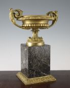 A gilt bronze and green serpentine marble urn, in neo-classical style, the shallow crater shaped