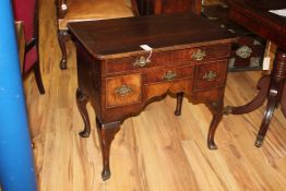 An 18th century and later walnut lowboy, with four drawers, cabriole legs and pointed pad feet, W.