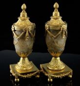 A pair of George III cassolettes by Matthew Boulton, each with a reversible sconce cast with stiff