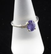 An 18ct white gold, tanzanite and diamond ring, with oval cut tanzanite and baguette cut diamond set