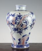 A Chinese underglaze blue and copper red `peach` Meiping vase, Qing Dynasty, the fruiting tree