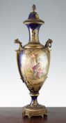 A Sevres style porcelain and ormolu mounted vase and cover, c.1900, painted with an oval reserve