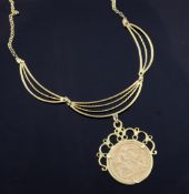 A Victorian sovereign pendant in later 9ct gold mount, on a 9ct gold necklace with pierced demi lune