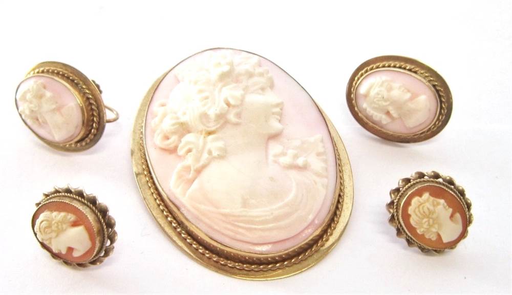 A 9CT GOLD CONCH SHELL CAMEO BROOCH PENDANT 5cm long; with a pair of matching screw earrings; and a