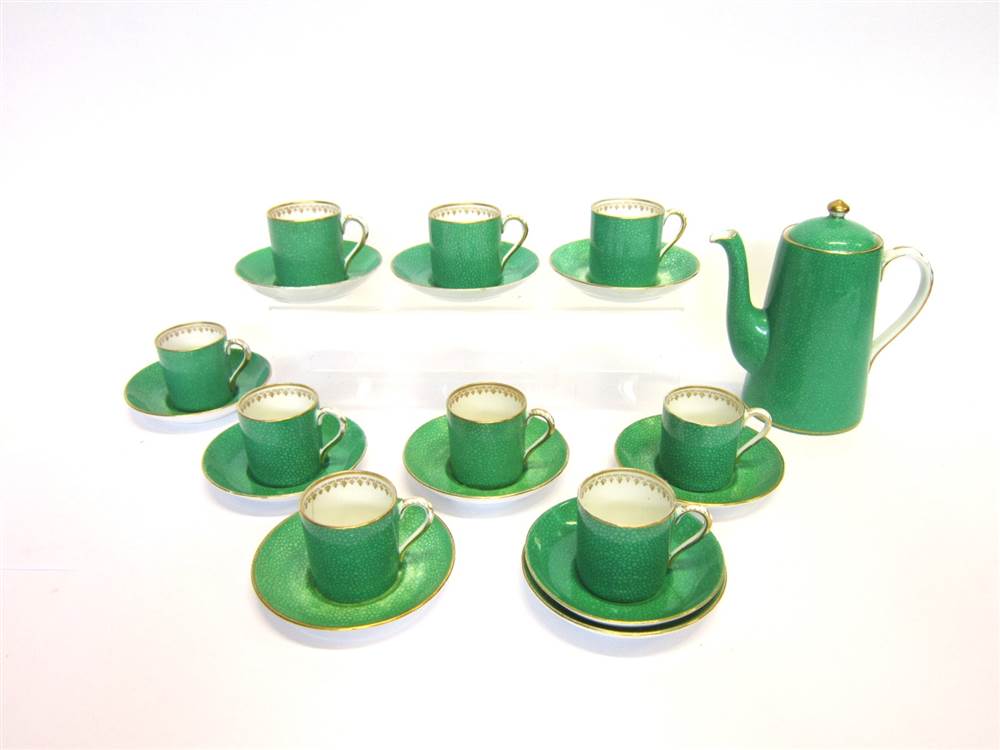 A JACKSON & GOSLING COFFEE SET comprising of one coffee pot and nine coffee cans, ten saucers in a