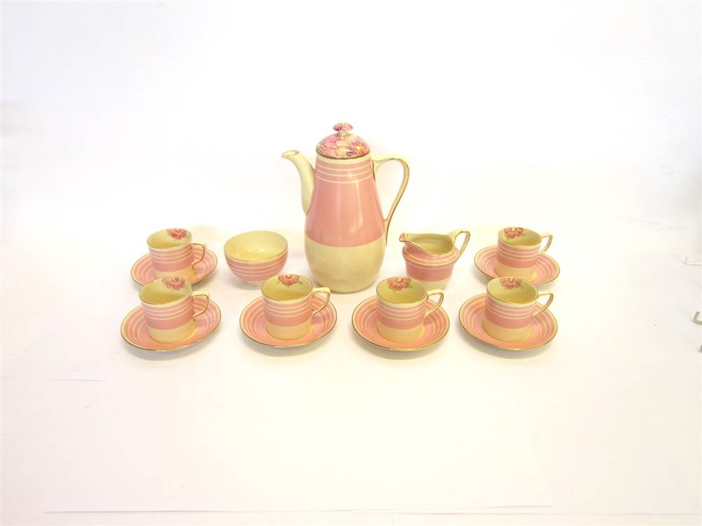 A GRAYS POTTERY ART DECO COFFEE SET in pink and cream with floral detail, comprising one coffee