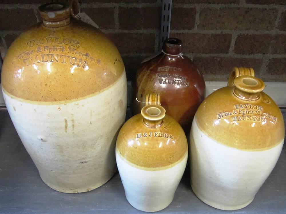 FOUR STONEWARE BOTTLES OF TAUNTON / SOMERSET INTEREST all with impressed marks, comprising two `