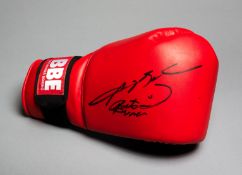 A boxing glove double-signed by Roberto Duran and Sugar Ray Leonard,
a red & blue BBE Brittania