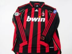 Ronaldo (Luis Nazario de Lima): a red & black striped AC Milan No.99 jersey season 2006-07,
long-