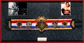 A replica of Carmen Basilio's World Middleweight Championship boxing belt, mounted together with a