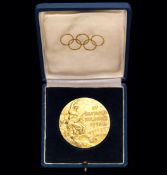 A Helsinki 1952 Olympic Games gold winner's prize medal,
in silver-gilt, small areas of gilding