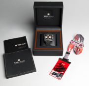 2010 Red Bull engraved TAG Heuer Monaco chronograph and team drivers signed pass,
the Calibre 12