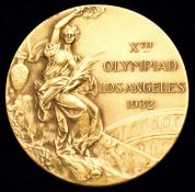 A specimen Los Angeles 1932 Olympic Games gold prize medal,
in gilt, the edge inscribed WHITEHEAD-