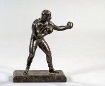 A bronze figure of a boxer,
rich brown patina, mounted on a marble base
21.5cm., 8 1/2in. high,