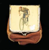 A leather money purse sent with an enamelled metal lid portraying a competitive cyclist,