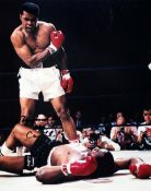 A Muhammad Ali signed “Phantom Punch” colour photograph, 10 by 8 in., signed in black marker pen “