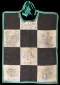 Chequered flag baby bib drawn and presented to Bette Hill by Jan Apetz,
featuring ink cartoons of