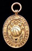 A 9ct. gold 1919 Football League v Scottish Football League Victory Match medal,
inscribed VICTORY