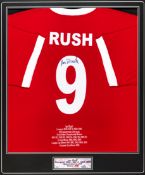 A signed Ian Rush Liverpool tribute shirt, reverse mounted, signed in black marker pen on the No.