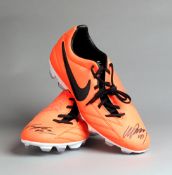 Wayne Rooney signed football boots,
salmon pink Nike T90, both signed in black marker pen to the