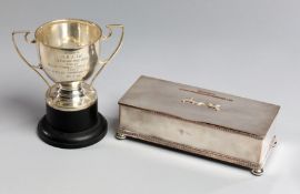 Two greyhound racing trophies presented at Stamford Bridge,
a hallmarked silver double-handled cup
