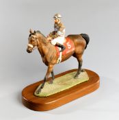 A Wedgwood porcelain sculpture of the American champion racehorse "John Henry" with Jockey up by
