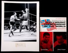 A Muhammad Ali signed photographic presentation,
a 12 by 10in. b&w press photograph of the Ali v