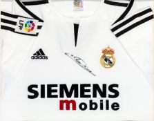 A replica Real Madrid jersey signed by Zinadine Zidane, signature in black marker pen, mounted,