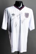 A white replica England No.10 jersey signed by four prolific goalscorers: Sir Bobby Charlton, Gary