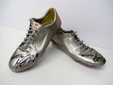 A pair of signed Marco Materazzi 2006 World Cup football boots,
both signed in black marker pen