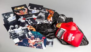Autographed boxing memorabilia,
comprising: a signed pair of Mike Tyson replica boxing trunks; a red