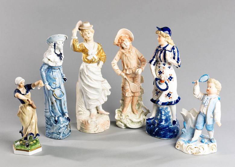 A group of six 19th century ceramic figurines depicting battledore and shuttlecock,
including an