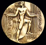 A boxed gold-plated 1936 Berlin Olympic Games participant's medal,
designed by O. Placzek, five