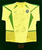 A yellow Brazil jersey signed by the 2002 World Cup winning squad, signatures in black marker pen,