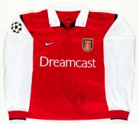 A signed Patrick Vieira red and white Arsenal Champions League jersey, signed in black marker pen,