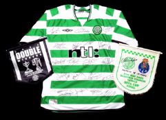 A replica Celtic jersey signed by the 2002-03 UEFA Cup finalists squad,
signatures in black marker