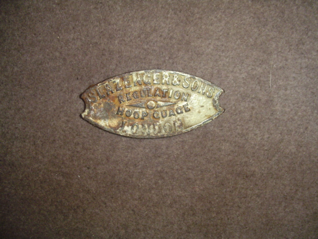 A Slazenger & Sons, London, cast iron croquet regulation hoop gauge circa 1900,
5 by 11cm., 2 by 4