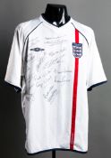 An England replica jersey signed by 10 of the 1966 World Cup finalists,
signatures in black marker